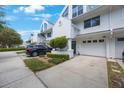 Charming townhouse with a one-car garage, well-maintained landscaping, and an inviting entrance at 14649 Seminole Trl # 5, Seminole, FL 33776