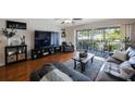 Inviting living room with hardwood floors, plush seating, and a sliding glass door to the lanai at 14649 Seminole Trl # 5, Seminole, FL 33776