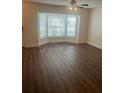 Bright living room featuring stylish hardwood floors and a bay window at 2007 W De Leon St # C, Tampa, FL 33606