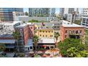 Stunning aerial view showcases buildings, local restaurants, and the cityscape at 215 Central Ave # 4F, St Petersburg, FL 33701