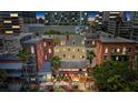 Aerial view showcasing the building exteriors, local restaurant, and cityscape at 215 Central Ave # 4F, St Petersburg, FL 33701