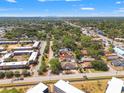 Aerial view showing community featuring mature trees, nearby commercial area and distant cityscape at 7134 2Nd N St, St Petersburg, FL 33702