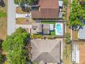 Aerial view of a home featuring a private pool, spa, pergola, and fenced yard at 7134 2Nd N St, St Petersburg, FL 33702