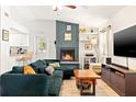 Inviting living room featuring a cozy fireplace, modern decor, and comfortable furnishings at 7134 2Nd N St, St Petersburg, FL 33702