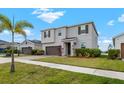 Attractive two-story home with a manicured front lawn and a cozy, inviting entrance at 13821 Kinsale St, Riverview, FL 33579