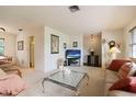 Open-concept living area boasts a neutral color palette, plush seating, and bright natural lighting at 14006 79Th Ave, Seminole, FL 33776