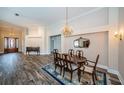 Elegant dining room with hardwood floors and a beautiful chandelier at 1522 Riverdale Dr, Oldsmar, FL 34677