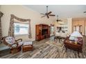Spacious living room featuring wood flooring, ceiling fans, and an open design at 1522 Riverdale Dr, Oldsmar, FL 34677