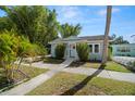 Charming single story home with well-manicured lawn and walkway in a tropical landscaped neighborhood at 2610 58Th S St, Gulfport, FL 33707