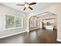Bright living room featuring hardwood floors and large windows for ample natural light at 2708 N Mitchell Ave, Tampa, FL 33602