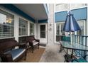 Relaxing outdoor patio area with comfortable seating and table at 343 Rex Pl # G, Madeira Beach, FL 33708