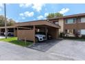 Assigned carport parking with well-maintained landscaping and a well-lit drive at 4027 Davit Dr, New Port Richey, FL 34652