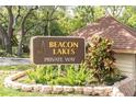 Beacon Lakes Private Way sign showing the neighborhood entrance with lush landscaping at 4027 Davit Dr, New Port Richey, FL 34652