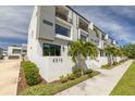 Contemporary home showcasing clean lines, large windows, and well-maintained landscaping at 4515 W North A St # 8, Tampa, FL 33609