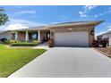 A bright, spacious home with a large two-car garage and well-maintained landscaping at 829 Golf Island Dr, Apollo Beach, FL 33572