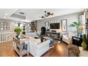 Inviting living room featuring hardwood floors, neutral paint, modern decor, and a comfortable sectional sofa at 166 E Davis Blvd, Tampa, FL 33606