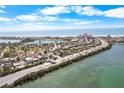 Aerial view of the property and surrounding neighborhood near the waterfront and beach at 3214 E Maritana Dr, St Pete Beach, FL 33706