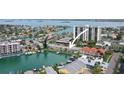 Scenic aerial perspective of waterfront condos with boat docks and ocean views at 400 Larboard Way # 103, Clearwater, FL 33767