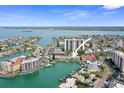 Breathtaking aerial view highlighting waterfront condos, boat docks, and vast ocean at 400 Larboard Way # 103, Clearwater, FL 33767
