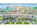 Aerial view showcases community near bay with lush landscapes, swimming pool, and various condo buildings at 4611 Duhme Rd # 1A, St Petersburg, FL 33708