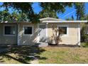 Inviting single-story home with mature trees and fresh landscaping at 5211 Jersey S Ave, Gulfport, FL 33707