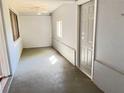 Sunroom features tile floors, natural light, and a ceiling fan at 5211 Jersey S Ave, Gulfport, FL 33707