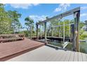 Boat lift and dock overlooking the water at 6317 Marbella Blvd, Apollo Beach, FL 33572
