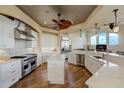 Gourmet kitchen features stainless steel appliances, quartz countertops, and a stylish center island at 109 Wateredge Ct, Safety Harbor, FL 34695