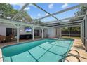 Inviting screened-in pool area, perfect for relaxation and outdoor entertainment at 11368 93Rd St, Largo, FL 33773