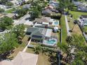 Aerial view showcasing a home with a backyard pool and well-maintained landscaping at 1601 14Th W St, Palmetto, FL 34221