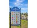 Southshore Bay community sign highlighting amenities like metro lagoon, green spaces and a dog park at 16633 Mooner Plank Cir, Wimauma, FL 33598
