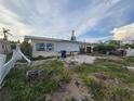 Spacious backyard, offering potential for customization and enjoyment of outdoor activities and landscaping at 249 144Th Ave, Madeira Beach, FL 33708