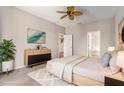 Well appointed primary bedroom suite with neutral paint, carpet and modern dresser at 3219 Gianna Way, Land O Lakes, FL 34638