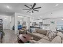 Open-concept living room seamlessly connects to the kitchen, creating a perfect space for entertaining at 5938 164Th E Ave, Parrish, FL 34219