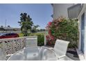 Private patio featuring an outdoor seating area and mature landscaping at 14800 Walsingham Rd # 301, Largo, FL 33774