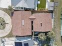 Aerial view of a single-Gathering home featuring a new roof and lush surroundings at 440 S Bayshore Dr, Madeira Beach, FL 33708