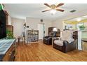 Cozy living room featuring hardwood floors, comfortable seating, ceiling fan and an open layout at 500 45Th S St, St Petersburg, FL 33711