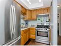 Efficient kitchen featuring stainless steel appliances and ample cabinet space for a modern cooking experience at 5850 21St N St # 12, St Petersburg, FL 33714