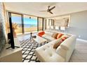 Beautiful living room featuring floor-to-ceiling windows and modern furnishings at 5940 Pelican Bay S Plz # 1105, Gulfport, FL 33707