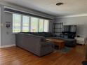 Bright living room with hardwood floors and large window providing ample natural light at 6221 13Th N Ave, St Petersburg, FL 33710