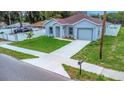 Beautifully landscaped front yard leading to a well kept single Gathering home at 8505 N Brooks St, Tampa, FL 33604
