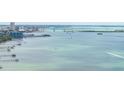Stunning waterfront views overlooking the bay with bridge and city skyline in the distance on a clear and sunny day at 1827 Venetian Point Dr, Clearwater, FL 33755