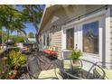 Inviting balcony featuring stylish furniture and a cozy seating area at 224 Ontario Ave, Crystal Beach, FL 34681