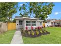 Charming single story home with lush green lawn and appealing landscaping at 4561 21St S Ave, St Petersburg, FL 33711