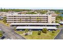 Well-maintained condo building with covered parking, lush landscaping and nearby water access at 9950 62Nd N Ter # 316, St Petersburg, FL 33708