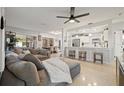 Bright and airy living room with an open floor plan, seamlessly connecting to the modern kitchen area at 1136 Serpentine S Dr, St Petersburg, FL 33705