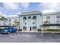 Beautiful exterior view of building with covered parking and well-maintained landscaping at 1706 Belleair Forest Dr # 336, Belleair, FL 33756