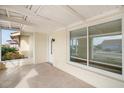 A well-lit enclosed patio with tile floors provides a cozy outdoor living space at 1805 Granville Ln, Sun City Center, FL 33573