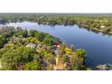 Aerial view of the property and lake showing home's location and proximity to the water at 18132 Oakdale Rd, Odessa, FL 33556