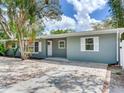 Inviting home exterior showcases modern design with mature landscaping, providing shade and curb appeal at 623 15Th Nw Ave, Largo, FL 33770